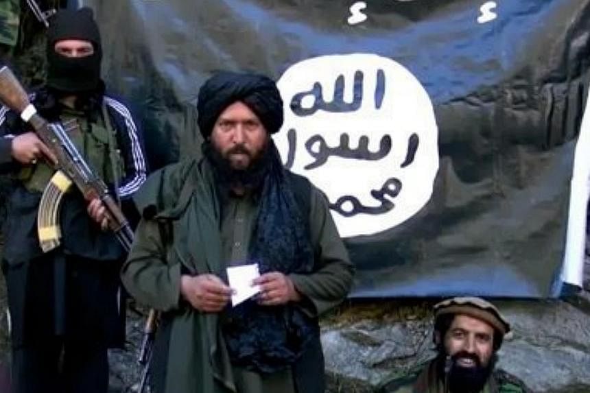 An image made from a video released by the&nbsp;Islamic State in Iraq and Syria (ISIS) on Jan 27,&nbsp;2015, purportedly showing Hafiz Said Khan (centre), head of the ISIS branch in Pakistan and Afghanistan. ISIS has killed three Chinese militants wh