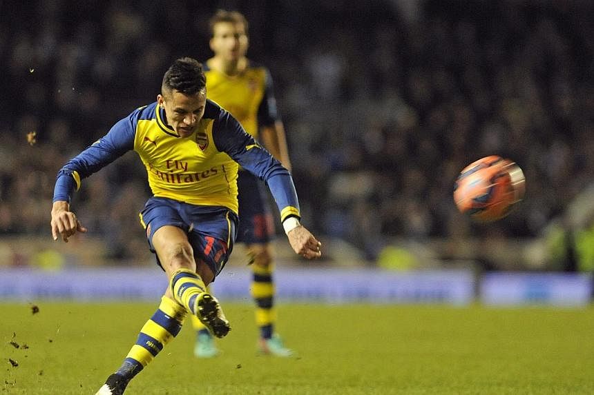 Arsenal forward Alexis Sanchez taking a free kick against Brighton during their FA Cup fourth round football match at the American Express Community Stadium in Brighton on Jan 25, 2015.&nbsp;-- PHOTO: EPA