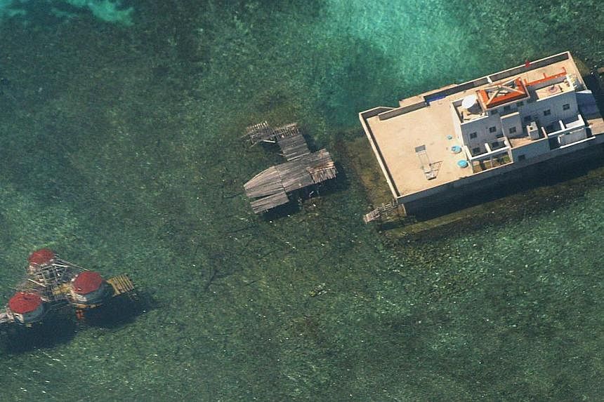 In this aerial file photograph taken from a Philippine Air Force aircraft on Nov 6, 2003, Chinese-built structures on the Mischief Reef in the disputed Spratly islands are seen strategically located in the South China Sea.&nbsp;-- PHOTO: AFP