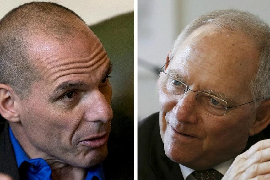 Greece's new finance minister Yanis Varoufakis (left) will meet his German counterpart Wolfgang Schaeuble on Thursday. Germany is seen as the strongest opponent of any easing in the terms of Greece's massive debts. -- PHOTOS: BLOOMBERG, REUTERS