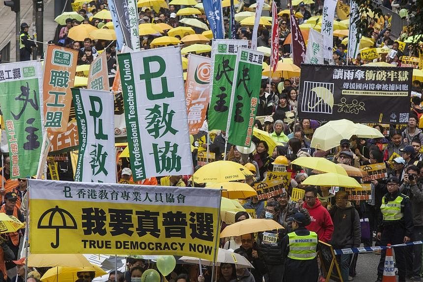 Protesters from Hong Kong's Umbrella Movement marching on Feb 1, 2015. -- PHOTO: EPA
