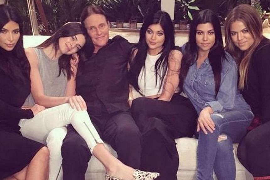 Bruce Jenner (third from left) sits with his daughters, Kendall and Kylie Jenner, and former step daughters, Kim, Kourtney and Khloe Kardashian.&nbsp;-- PHOTO: KHLOE KARDASHIAN/ INSTAGRAM
