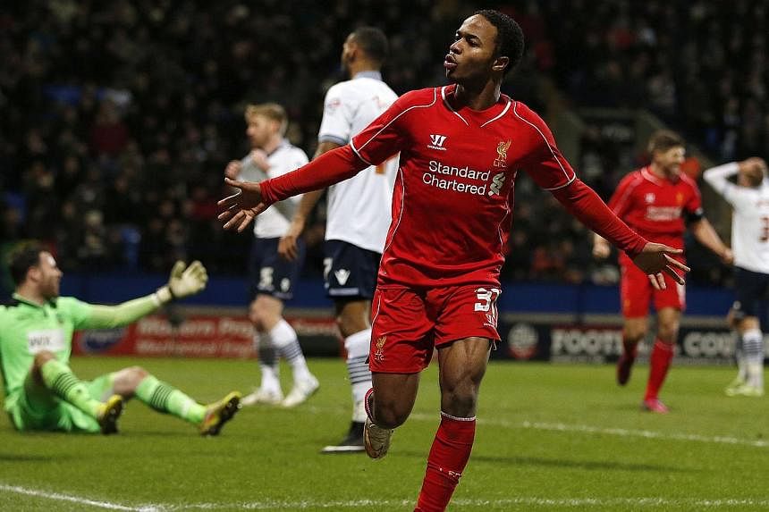 Liverpool's Raheem Sterling celebrates after scoring during their FA Cup fourth round replay soccer match against Bolton Wanderers at the Macron Stadium in Bolton, northern England on Feb 4, 2015. -- PHOTO: REUTERS