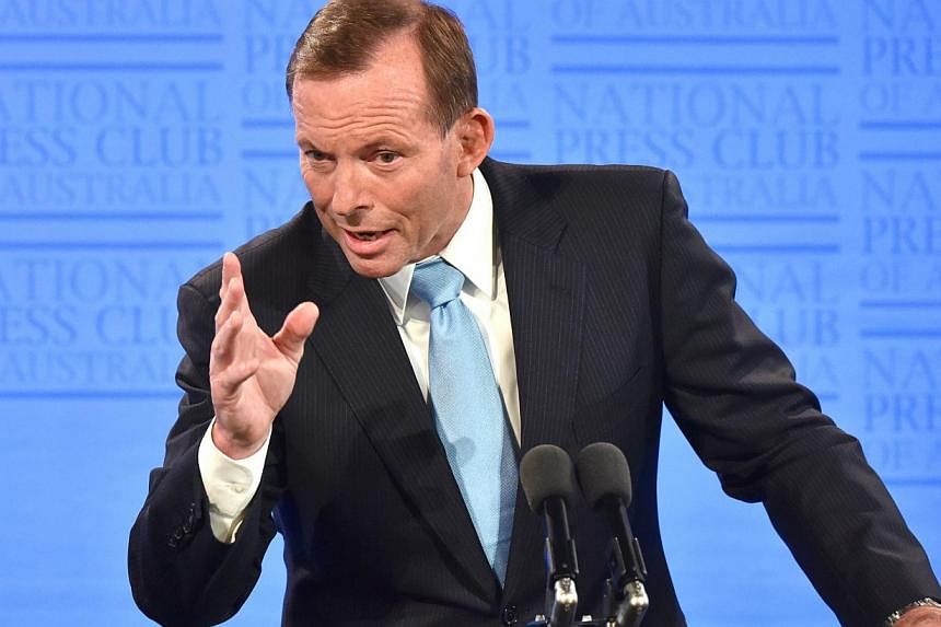 Defiant Australian Prime Minister Tony Abbott on Thursday said he was "very confident" he will still be in charge next week after a top Liberal figure fuelled speculation he may be toppled. -- PHOTO: BLOOMBERG