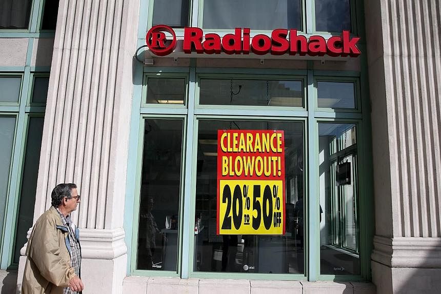 A sign reading, 'Clearance Blowout', is seen in the window of a RadioShack store on Feb 3, 2015 in Miami, Florida. Reports indicate that the New York Stock Exchange will suspend trading in RadioShack and delist the stock as the company may shut down 