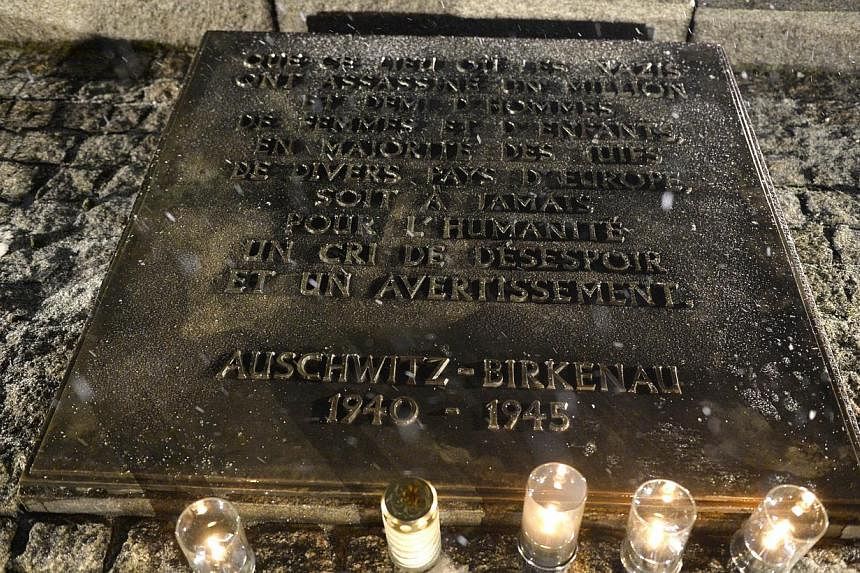 A plaque for victims of the Holocaust is seen on Jan 27, 2015 at the former Nazi concentration camp Auschwitz-Birkenau in Oswiecim, Poland. -- PHOTO: AFP