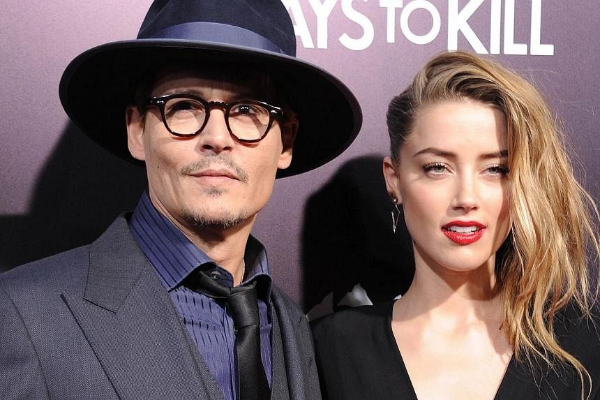 Actor Johnny Depp and actress Amber Heard made their marriage official at their home on Tuesday, ahead of their wedding on his private island in the Bahamas this weekend, says People magazine. -- PHOTO: AFP