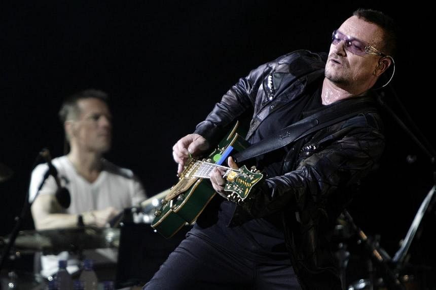 Lead singer Bono of the rock band U2 performing with the band in Chicago in a 2009 file photo.&nbsp;Irish rock group U2 said Wednesday it was adding two dates in London and Barcelona to its Europe and North America tour this year after concerts sold 