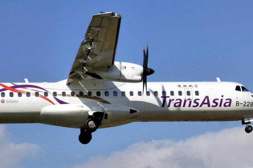 An ATR 72 mid-range, twin-engined turboprop passenger plane of TransAsia Airways taking off from the Taipei Sungshan Airport in Taipei, Taiwan, Dec 6, 2014. Taiwan's TransAsia Airways said Friday all its 71 ATR pilots will have to take a flight skill