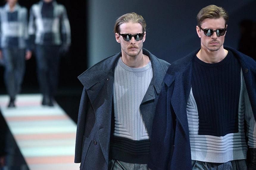 Model present creations part of the Giorgio Armani collection show during the Fall/Winter 2015 Men's Fashion Week on Jan 20, 2015, in Milan.&nbsp;New York will cement its status as world fashion capital in July by launching a men's fashion week to sh