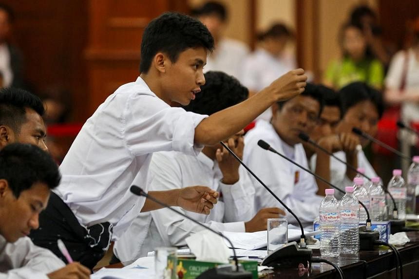 Young student representatives in action at an open talk over the National Education Bill which is due to be passed by parliament in Yangon, Myanmar on&nbsp;Feb 1,&nbsp;2015. -- PHOTO: EPA
