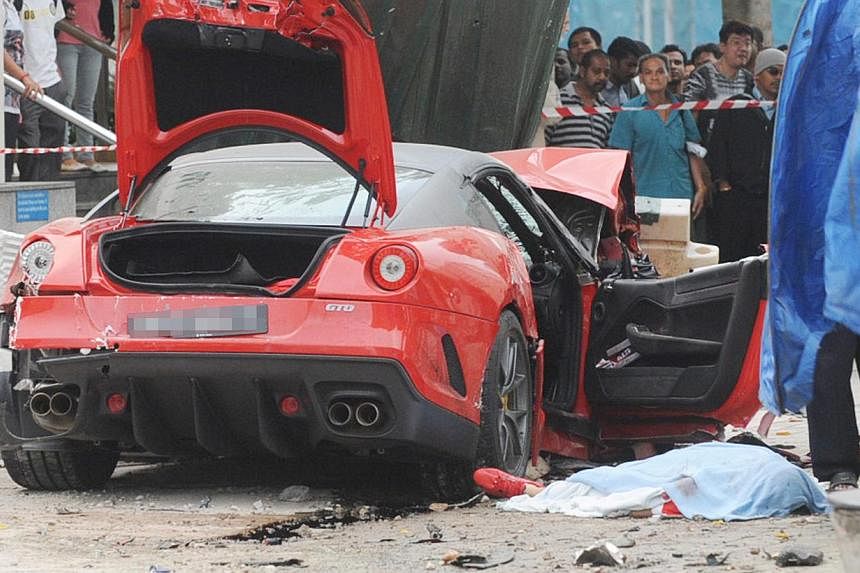 The parents of the Japanese woman who was killed in a shocking car crash along Rochor Road in 2012 have reached a settlement with the insurer of Ferrari driver Ma Chi, who crashed his car into a taxi that Ms Ito was in. -- PHOTO: LIANHE WANBAO