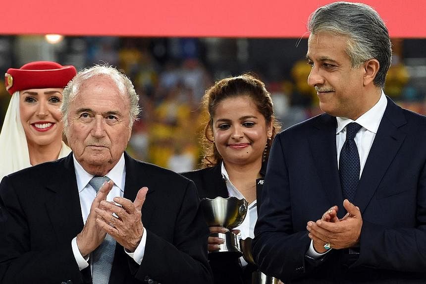 FIFA president Sepp Blatter (left) and AFC president Shaikh Salman bin Ebrahim Al Khalifa clapping during the prize distribution ceremony at the end of the AFC Asian Cup football final in Sydney on Jan 31, 2015. Blatter on Friday warned Qatar against