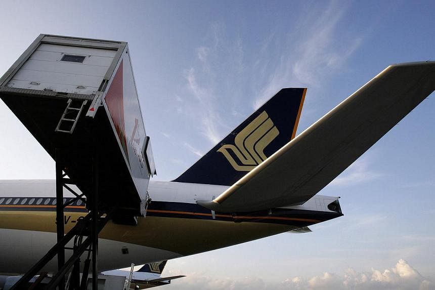 Singapore Airlines Ltd (SIA) expects earnings to be impacted by high jet fuel hedges and competition as it reported quarterly profit below market estimates.&nbsp;--PHOTO: REUTERS