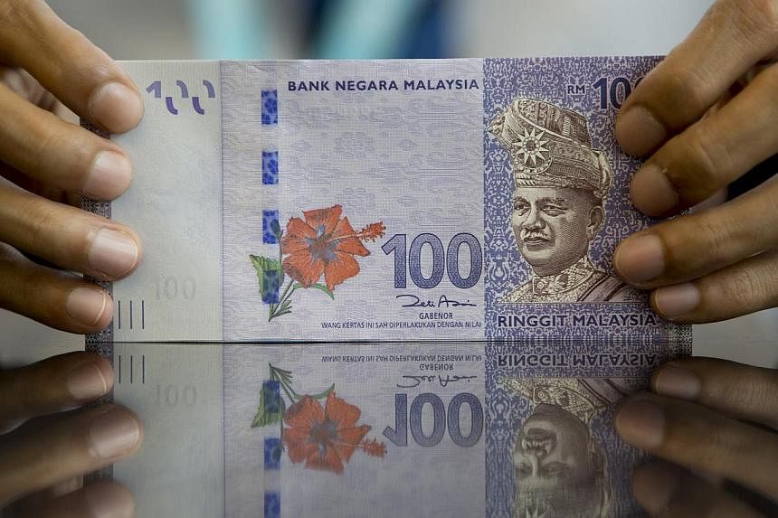 The currency appreciated 2.5 per cent to 3.5452 per US dollar as of 9am in Kuala Lumpur in a shortened trading week due to holidays Monday and Tuesday. -- PHOTO: BLOOMBERG