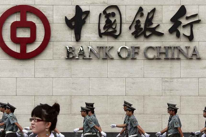 After a slew of gloomy economic data, the People's Bank of China cut banks' reserve requirement ratios by 50 basis points on Wednesday, freeing up an estimated 600 billion yuan (S$129.34 billion) into the money supply. -- PHOTO:&nbsp;REUTERS