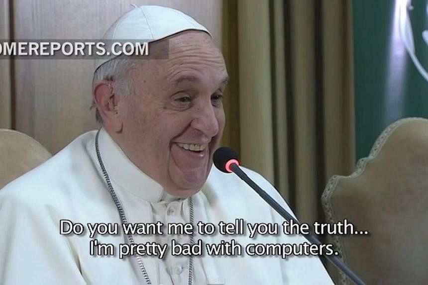 A screenshot from an online report in which the Pope confesses to special needs children in a global Google Hangout chat on Thursday that he is not too good with computers. -- PHOTO: YOUTUBE
