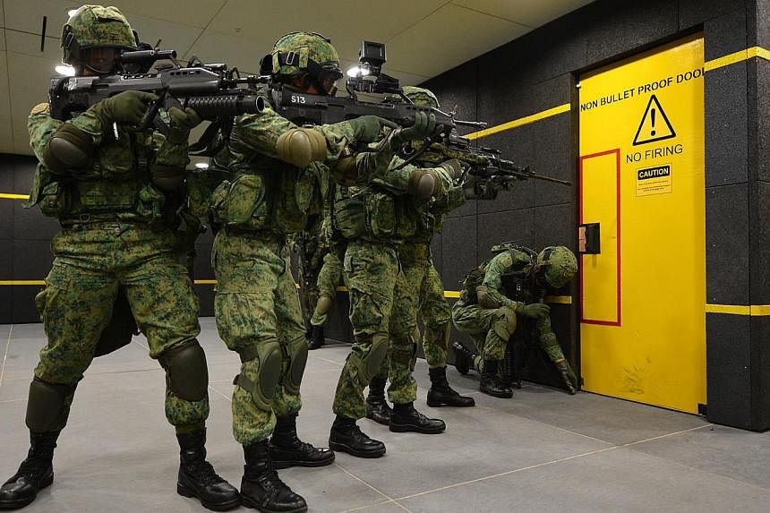 NS men in action at the SAF Multi-Mission Range Complex (MMRC) located at Pasir Laba. The Singapore Armed Forces (SAF) will be conducting military exercises at 16 places across the island from 8am on Monday, Feb 9, to 8am on Feb 16. -- ST PHOTO: CARO