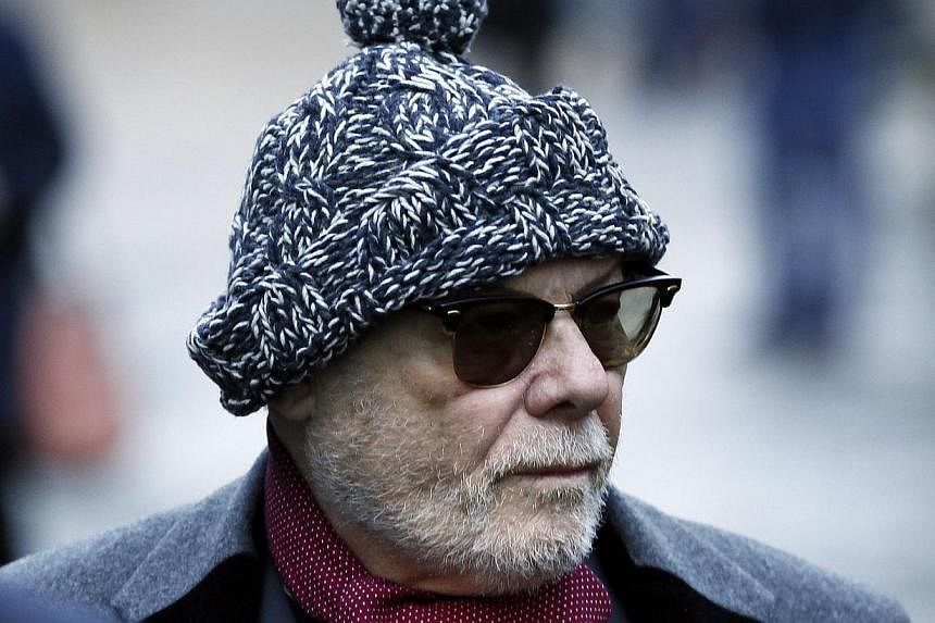 Former British pop star Gary Glitter, whose real name is Paul Gadd, arriving at Southwark Crown Court in London on Jan 13, 2015. -- PHOTO: REUTERS