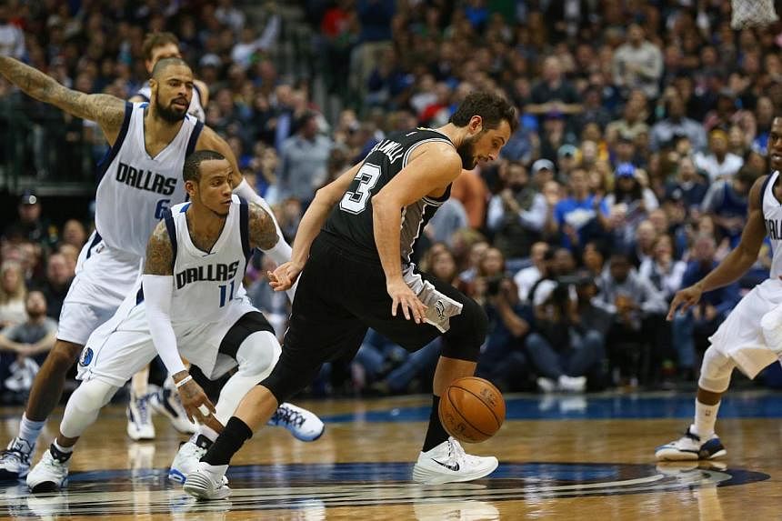 Marco Belinelli of the San Antonio Spurs dribbling the ball against Monta Ellis of the Dallas Mavericks at the American Airlines Centre on Dec 20 last year in Dallas, Texas.&nbsp;Belinelli will try to become the first repeat winner of the event since