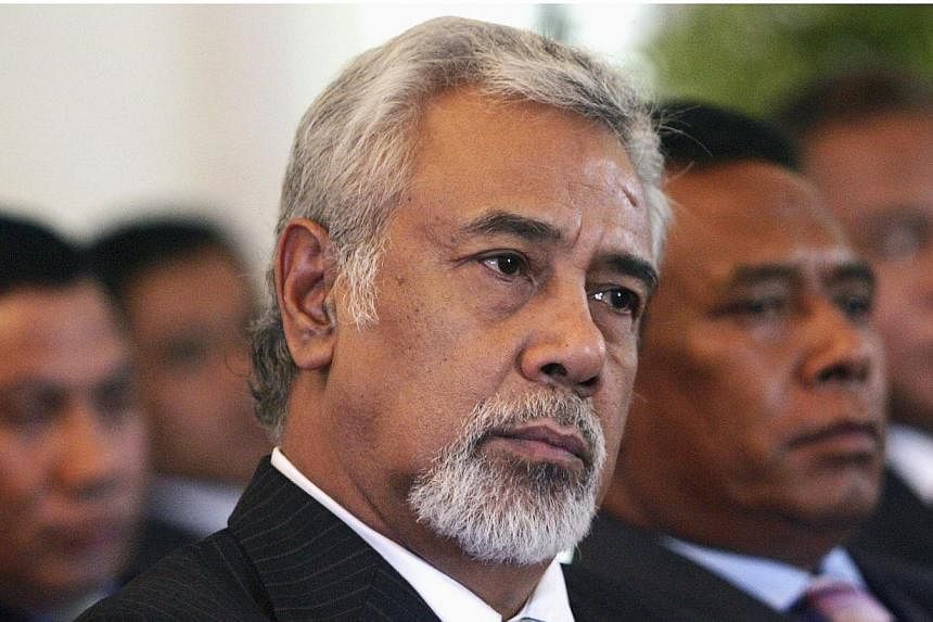 East Timor's Prime Minister Xanana Gusmao (centre) sits with cabinet members as he waits to be sworn in as the new Prime Minister in Dili in this 2012 file photo. -- PHOTO: REUTERS