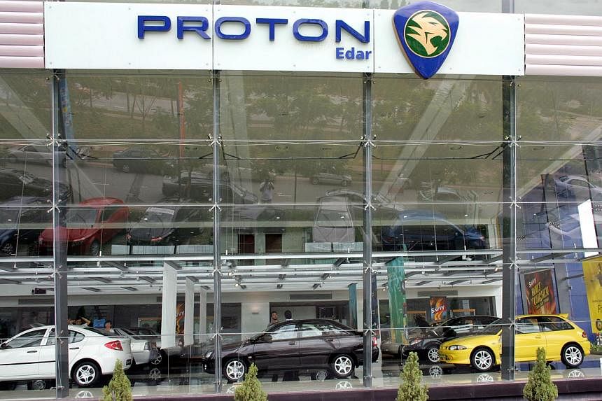 Malaysia's Proton Holdings Bhd has signed a memorandum of understanding (MoU) to develop and manufacture an Indonesian national car, one of the accords reached during Indonesia President Joko Widodo's first bilateral visit to Malaysia. -- PHOTO:&nbsp