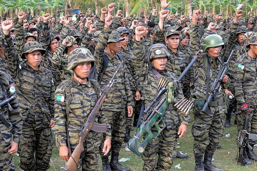 Moro Islamic Liberation Front (MILF) rebels in their camp on&nbsp;Mindanao in 2014. -- PHOTO: AFP