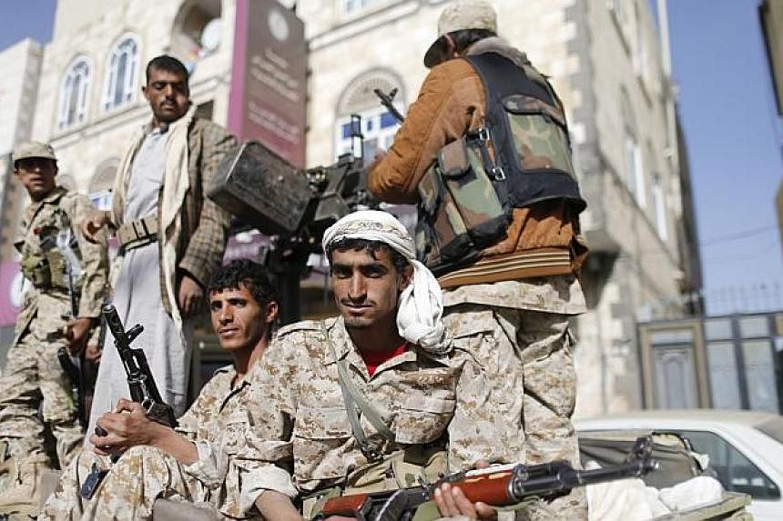 &nbsp;Huthi fighters ride a truck while patrolling a street in Sanaa Jan 21, 2015. -- PHOTO: REUTERS