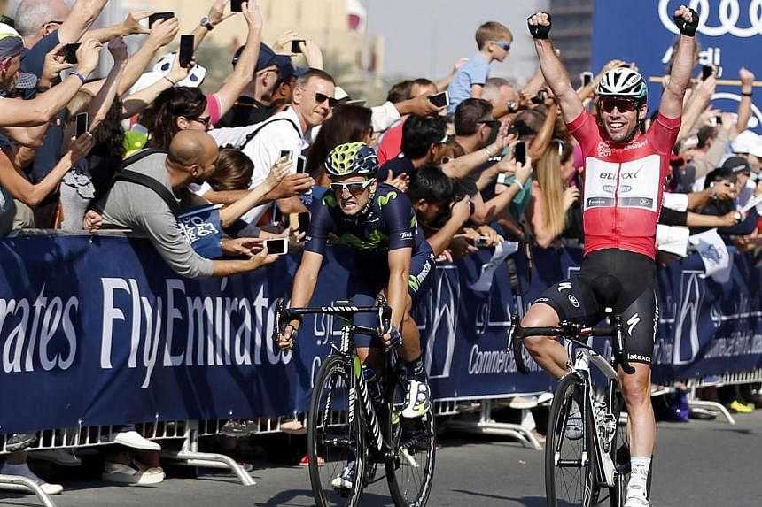 Briton&nbsp;Mark Cavendish (right) of Etixx-Quick-Step team reacts at the end of the fourth and last stage of the Dubai tour on Feb 7, 2015. Cavendish won cycling's Dubai Tour after sprinting to victory in the fourth and final stage on Saturday. -- P