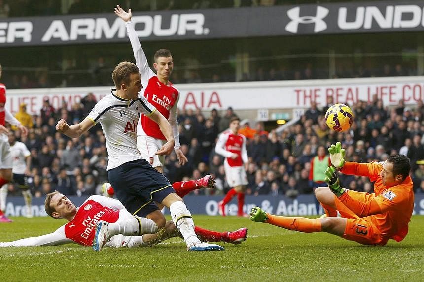 David Ospina of Arsenal saves a shot from Harry Kane of Tottenham Hotspur during their English Premier League soccer match at White Hart Lane, London on Feb 7, 2015. Local hero Kane scored twice as Tottenham Hotspur leapfrogged Champions League quali