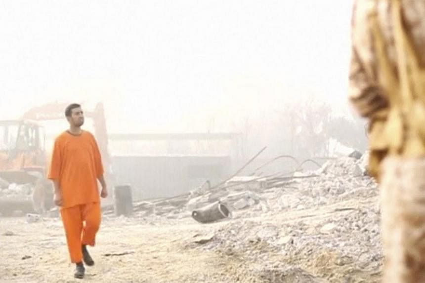 A still image from a video made available on social media purportedly shows Jordanian pilot Muath al-Kasaesbeh in an undisclosed location. Lieutenant Kasaesbeh was burned alive by ISIS militants, allegedly in retaliation for dropping a bomb from his 