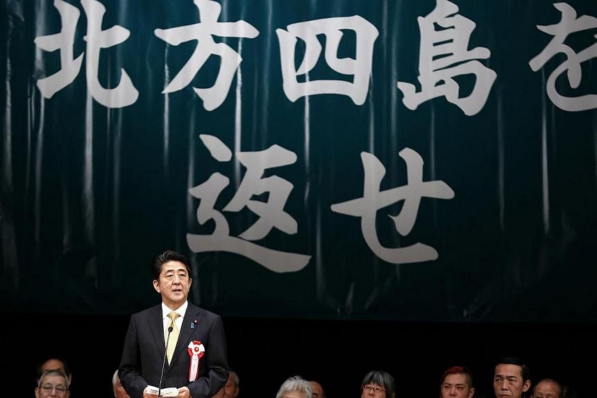 Japan's Prime Minister Shinzo Abe speaks during a Northern Territories Day rally to call on Russia to return a group of islands, known as the Northern Territories in Japan and the Southern Kuriles in Russia, in Tokyo on&nbsp;Feb 7, 2015. Mr Abe on Sa