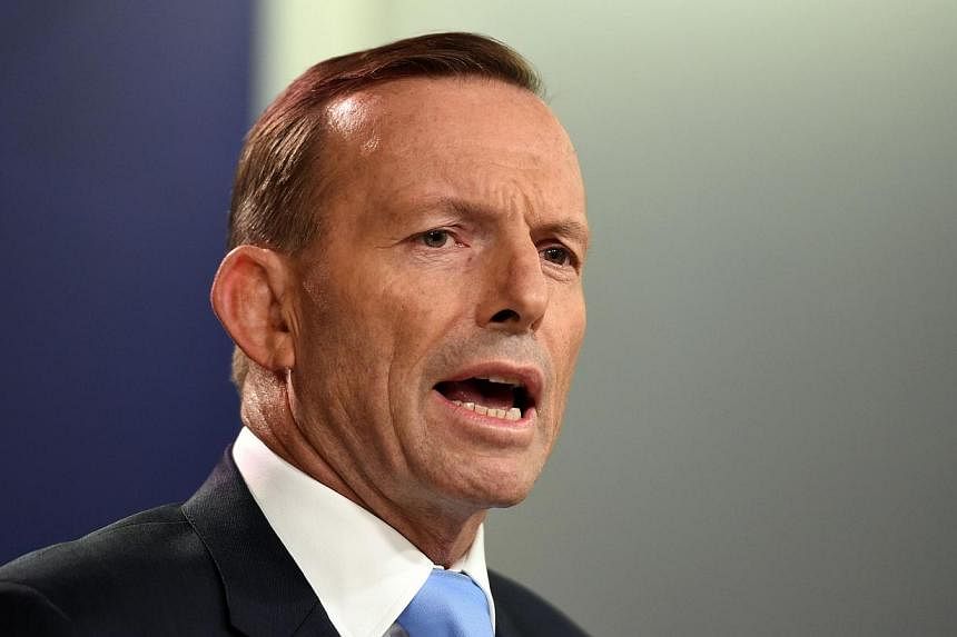Australia's Prime Minister Tony Abbott speaking during a press conference in Sydney on Feb 6, 2015. -- PHOTO: AFP
