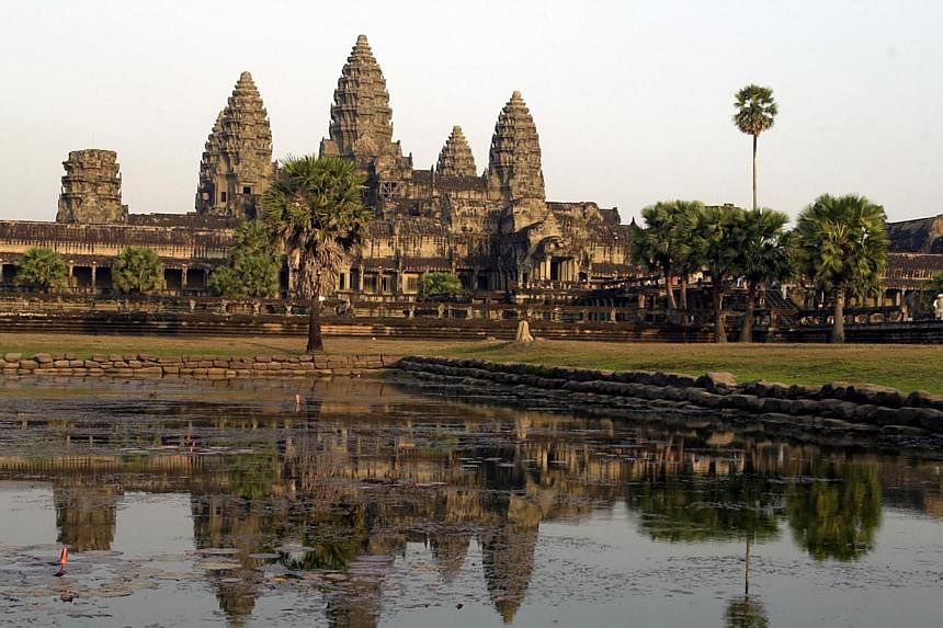 The Angkor Wat temple in Siem Reap, Cambodia. Two American sisters have been deported from the country after they were convicted of taking naked photos inside the famed Angkor temple complex. -- PHOTO: ST FILE