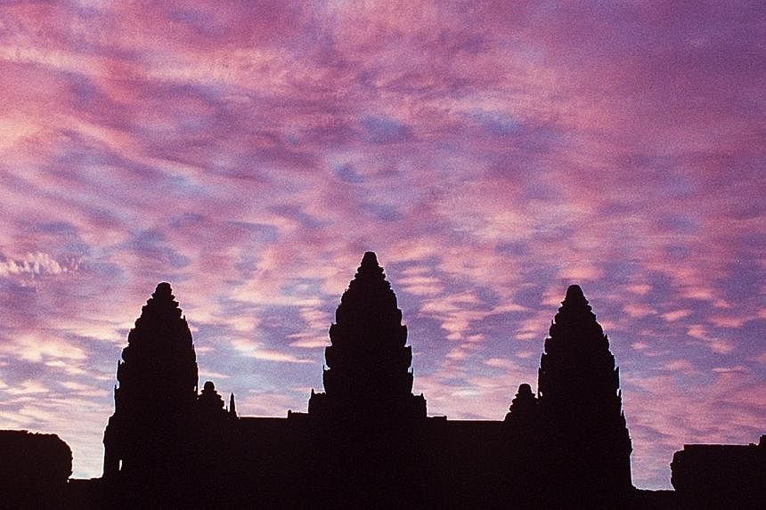Angkor Wat at sunrise.&nbsp;Two American sisters were deported from Cambodia on Feb 8, 2015, after they were convicted of taking naked photos inside the country's famed temple complex. -- ST PHOTO:&nbsp;MALCOLM MCLEOD&nbsp;