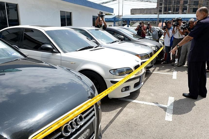 Some of the cars which were seized during the Feb 4, 2015, operation&nbsp;around Johor Baru.&nbsp;-- PHOTO: BERITA HARIAN
