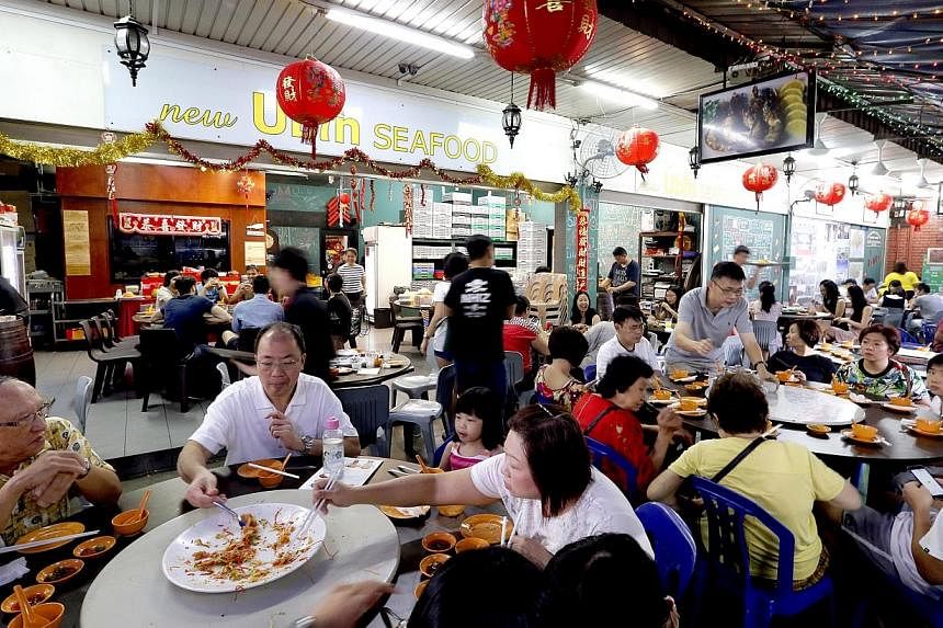 More than $10,000 was raised for The Straits Times School Pocket Money Fund (SPMF) at a charity luncheon on Sunday afternoon at New Ubin Seafood along Sin Ming Road. -- ST PHOTO: CHEW SENG KIM