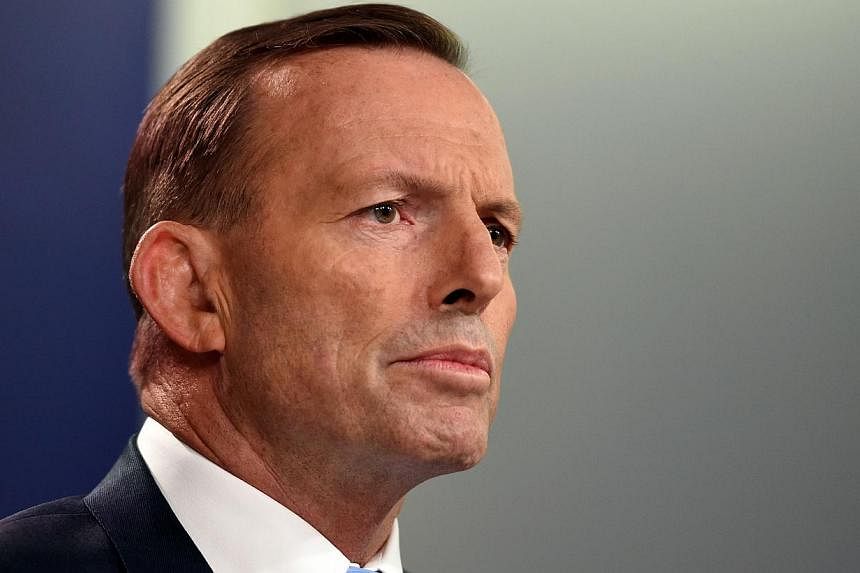 "It is important to end the uncertainty at the very beginning of the parliamentary sitting week," Mr Abbott said in a brief statement on Sunday, calling for a meeting early on Monday. -- PHOTO: AFP