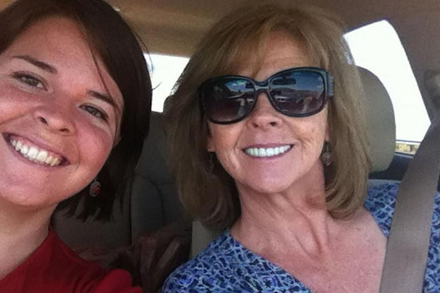 ISIS hostage Kayla Mueller (above left) in an undated photo with her mother, Marsha Mueller.&nbsp;The young American hostage who Islamic State in Iraq and Syria (ISIS) says was killed in a Jordanian air strike was condemned to death by the militant g