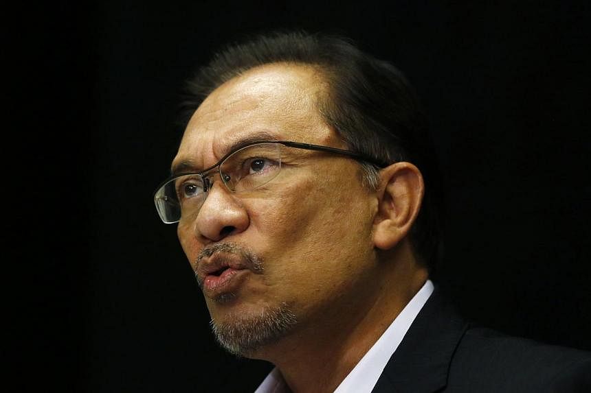 Malaysia's opposition leader Anwar Ibrahim speaking to the media ahead of the verdict in his final appeal against a conviction for sodomy in Kuala Lumpur on Feb 4, 2015.&nbsp;-- PHOTO:&nbsp;REUTERS