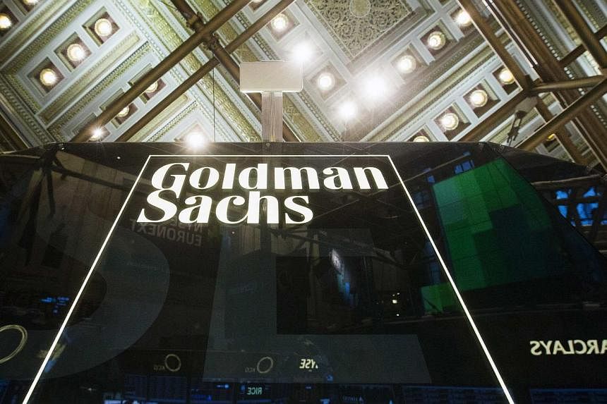 A Goldman Sachs sign is seen above the floor of the New York Stock Exchange after the opening bell, in this file photo taken Jan 24, 2014. -- PHOTO: REUTERS