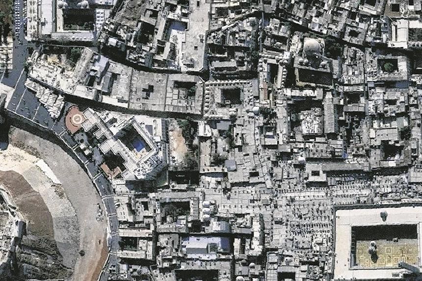 This handout picture provided on Dec 23, 2014 by UNITAR-UNOSAT shows close-ups of satellite-detected images of the historic heart of the northern Syrian city of Aleppo on Nov 21, 2010. -- PHOTO: AFP
