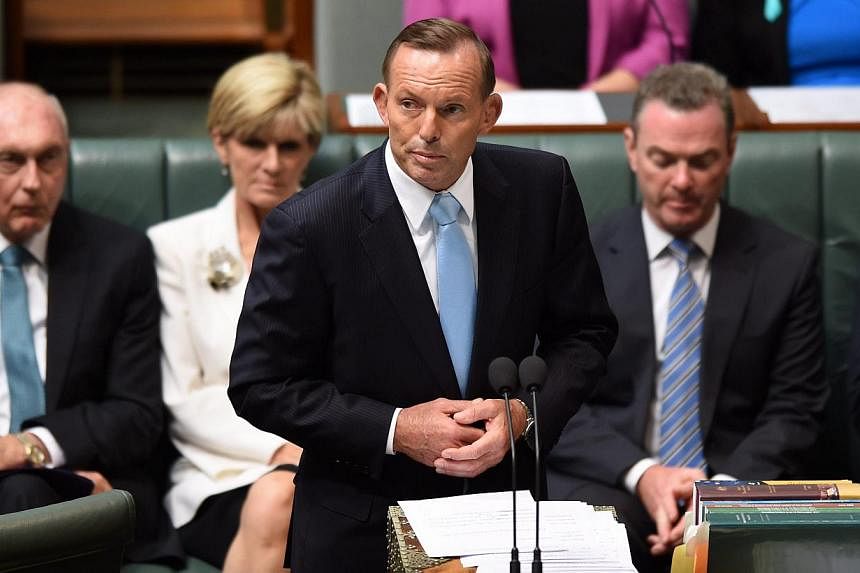 Australian Prime Minister Tony Abbott speaks during a condolence motion for the Sydney siege survivors at Parliament House in Canberra, Australia on Feb 9, 2015. The lone gunman which killed two hostages during the siege was inspired by the Islamic S