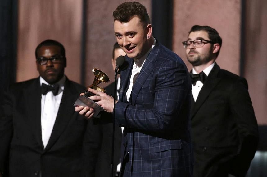 Sam Smith accepts the award for record of the year for 'Stay With Me (Darkchild Version)' at the 57th annual Grammy Awards in Los Angeles, California on Feb 8, 2015. The British soul singer was the big winner on Sunday, taking both Record and Song Of