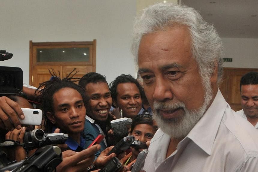 East Timor's then Prime Minister Xanana Gusmao (right) speaks to journalists in Dili after a meeting with President Taur Matan Ruak on Feb 2, 2015.&nbsp;The President accepted the resignation of independence hero Gusmao as prime minister on Monday, F