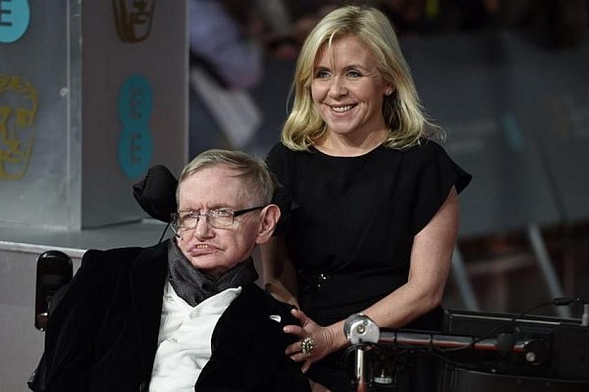British scientist Stephen Hawking (left) and his daughter Lucy Hawking (right) arrive on the red carpet for the 2015 British Academy Film Awards ceremony at The Royal Opera House in London, Britain on Sunday. The ceremony is hosted by the British Aca