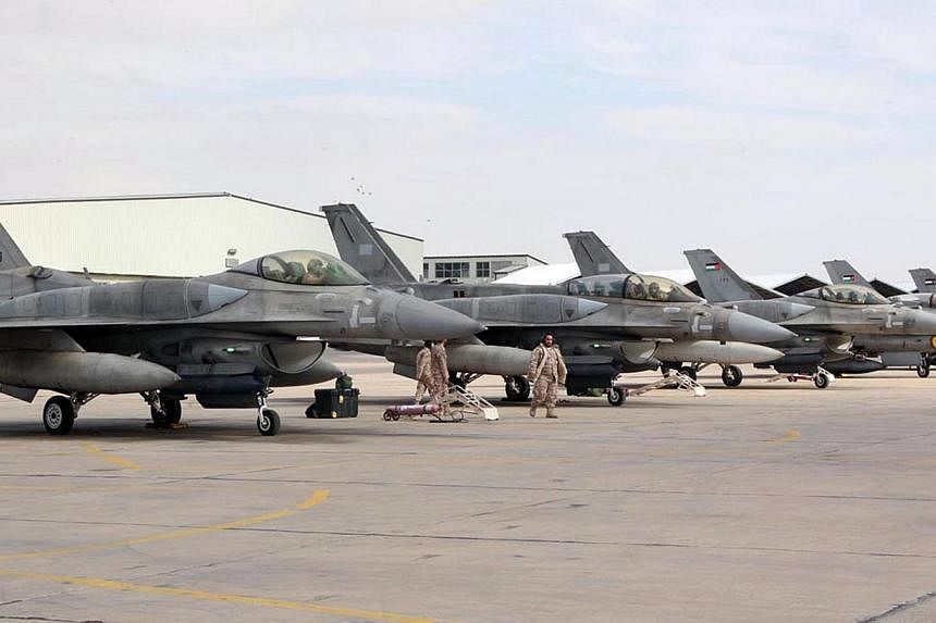 A squadron of United Arab Emirates F-16 fighters stationed in one of Jordan's air bases to support strikes against the Islamic State group on Feb 8, 2015. -- PHOTO: AFP