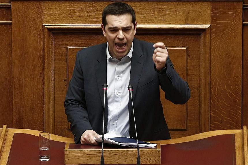 Greek Prime Minister Alexis Tsipras delivering his first major speech in Parliament in Athens on Feb 8, 2015. -- PHOTO: REUTERS