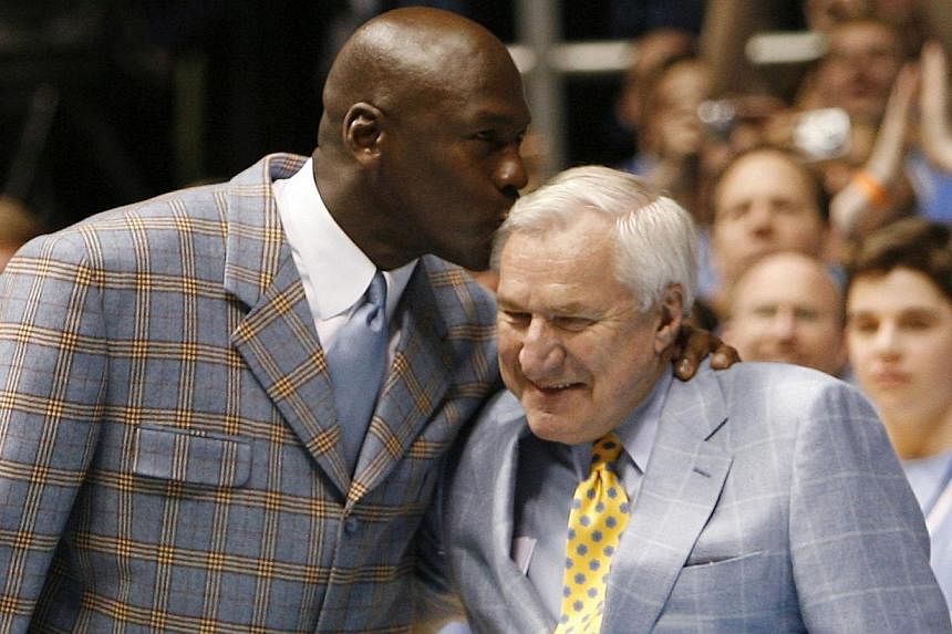 Michael Jordan (left) and Dean Smith at halftime of the NCAA basketball game between North Carolina and Wake Forest University in Chapel Hill, North Carolina, on Feb 10, 2007. -- PHOTO: REUTERS