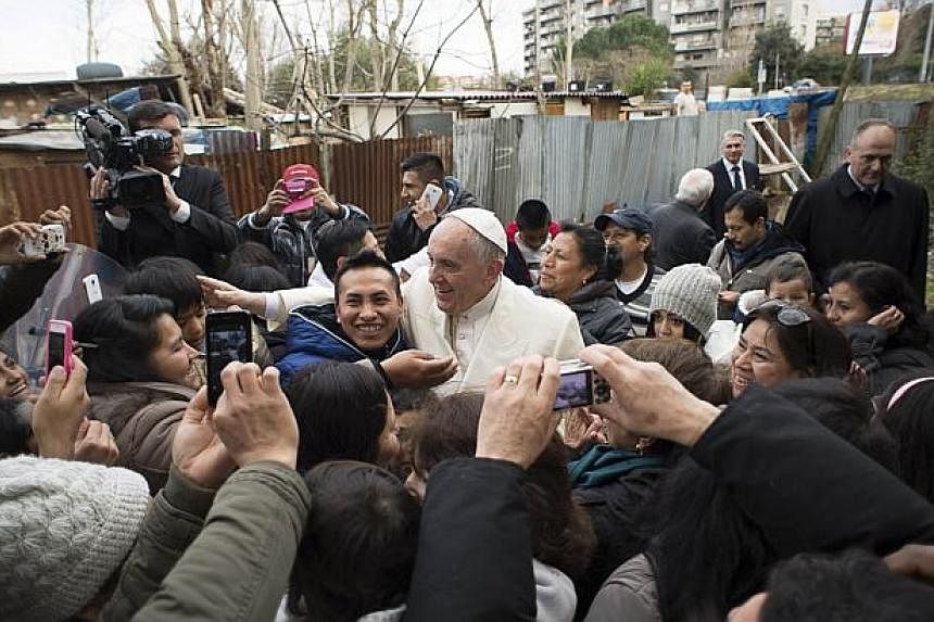 Pope Francis visits a shantytown on the outskirts of Rome on Sunday. Pope Francis, stunning poor residents, many of them from his native South America. The pope was on his way to a visit to a parish in the working class Tiburtina area when he asked a